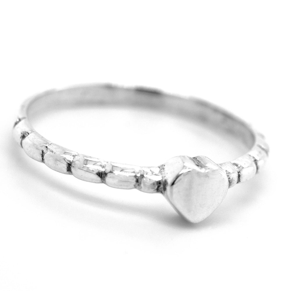 A Petite Patterned Heart Band featuring a hammered texture, displayed on a white background.