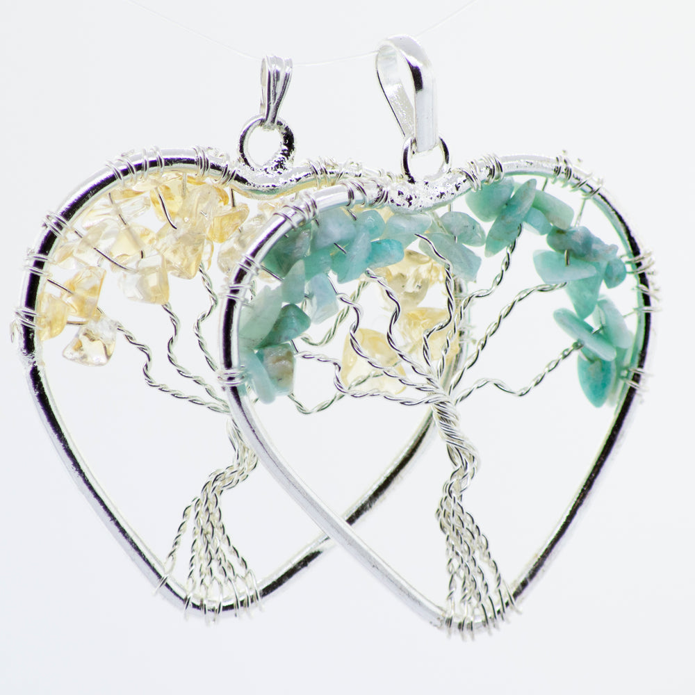 
                  
                    A Super Silver Heart Shaped Tree of Life Pendant featuring a beautiful tree of life design, forming a heart shape.
                  
                