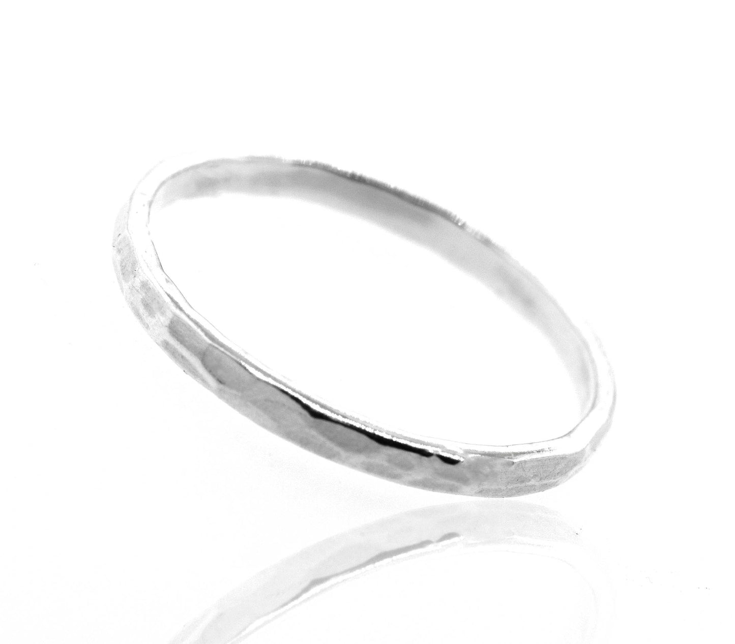 A Super Silver Stylish 2mm Hammered Band with a simplistic style on a white surface.