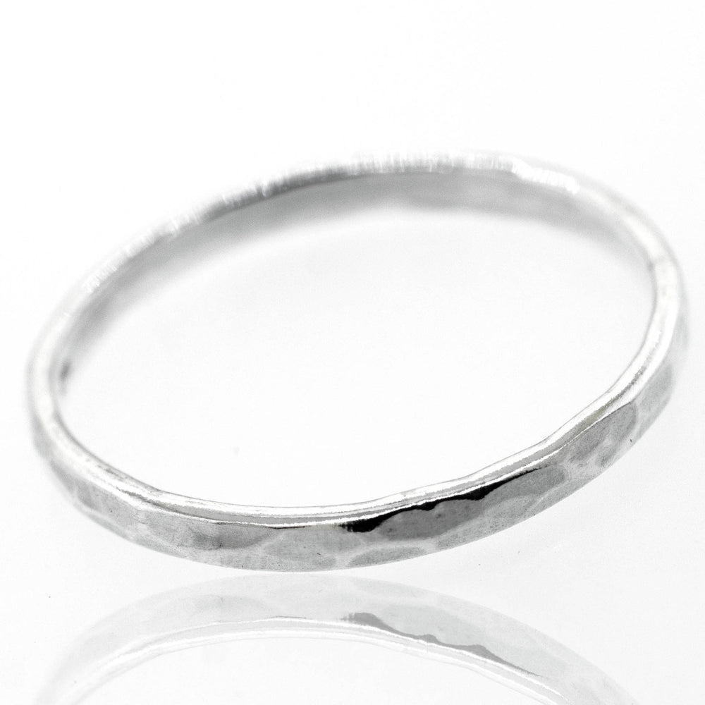 
                  
                    A Stylish 2mm Hammered Band on a white surface.
                  
                