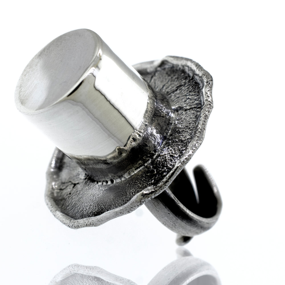 An Artisans Top Hat Ring on a white background.