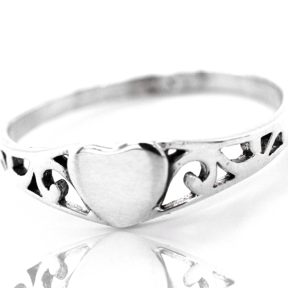 An exquisite sterling silver Heart Ring With Swirl Design adorned with a beautiful heart.