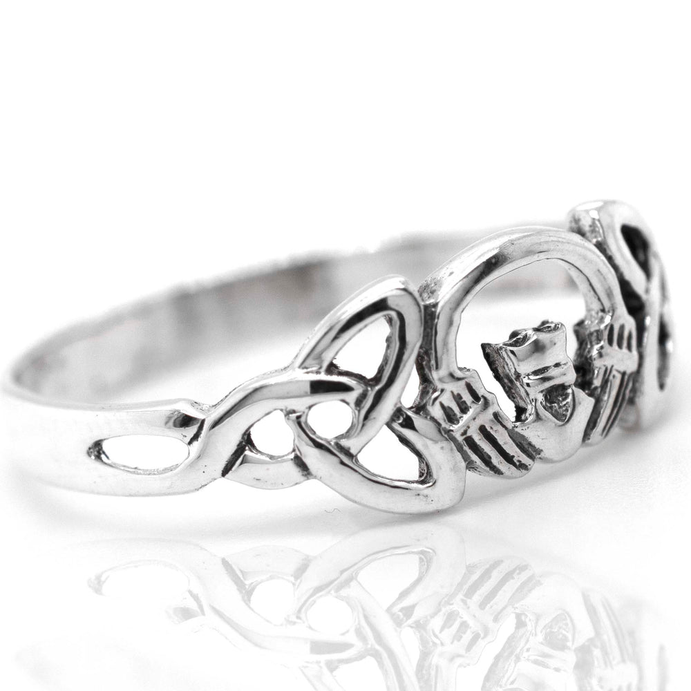 This sterling silver Claddagh Ring With Trinity Knot embodies the essence of love and Celtic culture. Suitable for engagement or as a meaningful gift, it showcases beautiful craftsmanship.