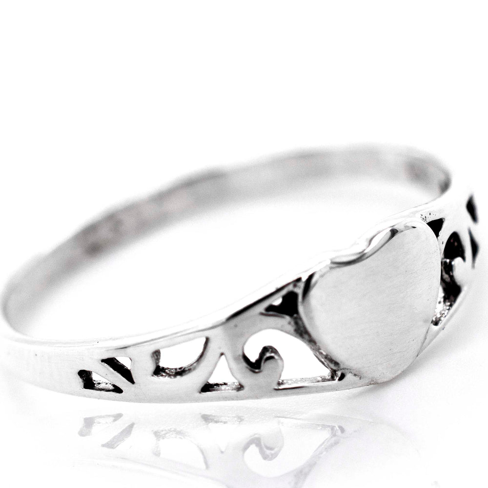 A minimalist Heart Ring With Swirl Design perfect for expressing love.