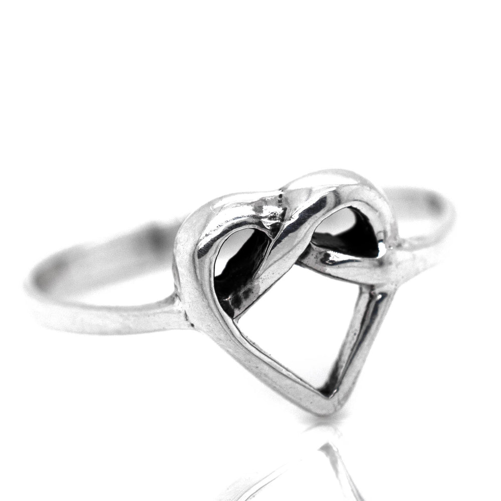 
                  
                    A minimalist Entwined Heart Knot Ring, symbolizing love.
                  
                