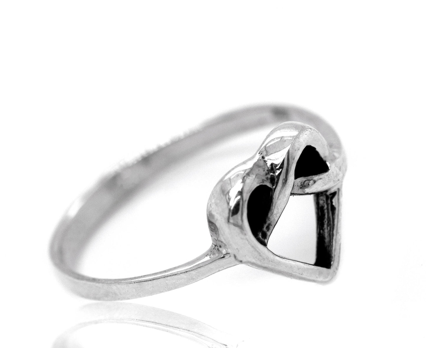 
                  
                    A silver Entwined Heart Knot Ring adorned with black stones, symbolizing love and affection.
                  
                
