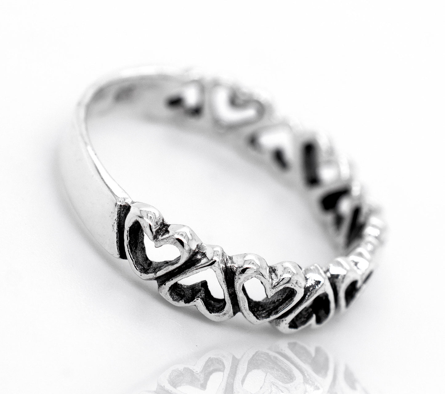 A minimalist silver Cut Out Alternating Heart Band, perfect for expressing love.