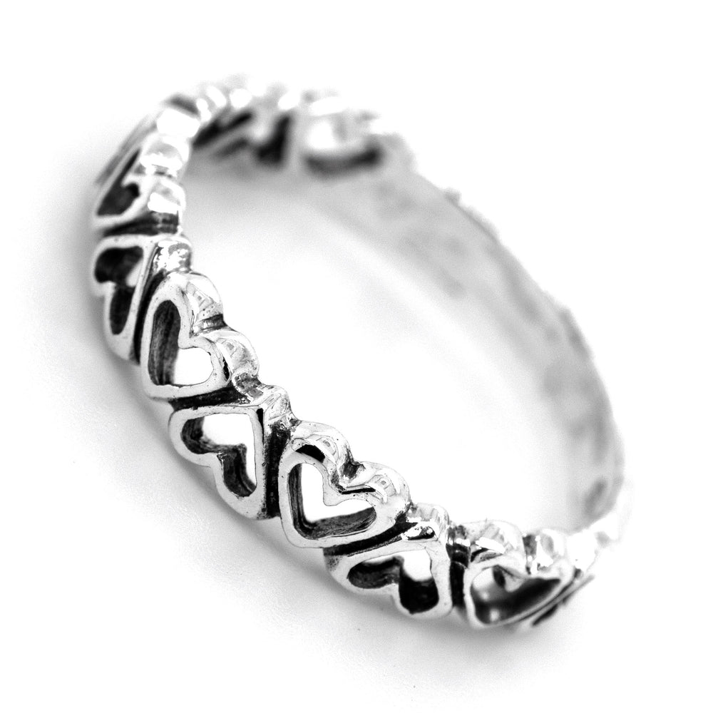 
                  
                    A Cut Out Alternating Heart Band adorned with miniature hearts, symbolizing love and ideal for engagement.
                  
                