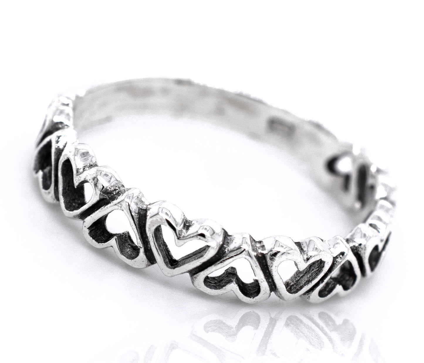 A minimalist Cut Out Alternating Heart Band sterling silver ring, perfect for engagement.