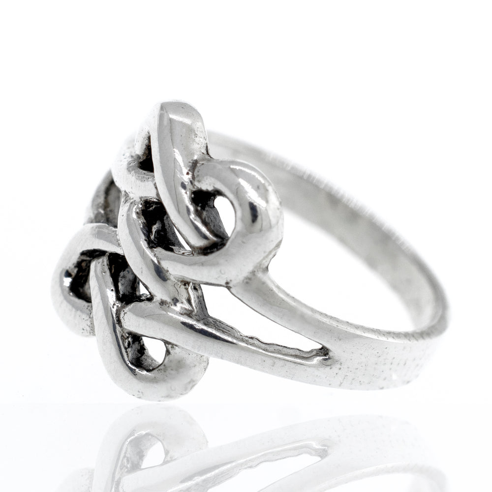 
                  
                    Sterling silver Celtic knot ring becomes Sterling silver Celtic Knot Design Ring.
                  
                