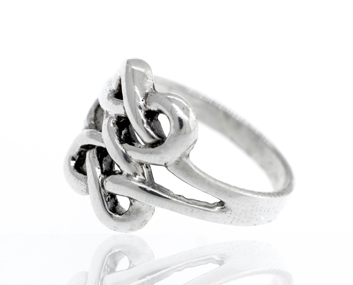 
                  
                    Sterling silver Celtic knot ring becomes Sterling silver Celtic Knot Design Ring.
                  
                