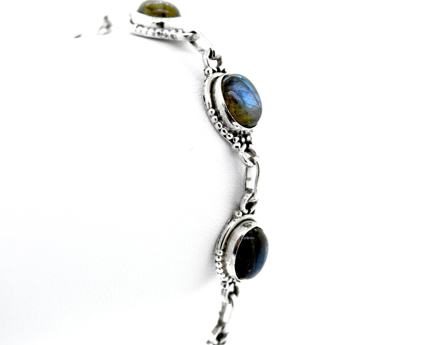 
                  
                    A Super Silver Oval Gemstone Bracelet With Half Ball Border with labradorite gemstones.
                  
                