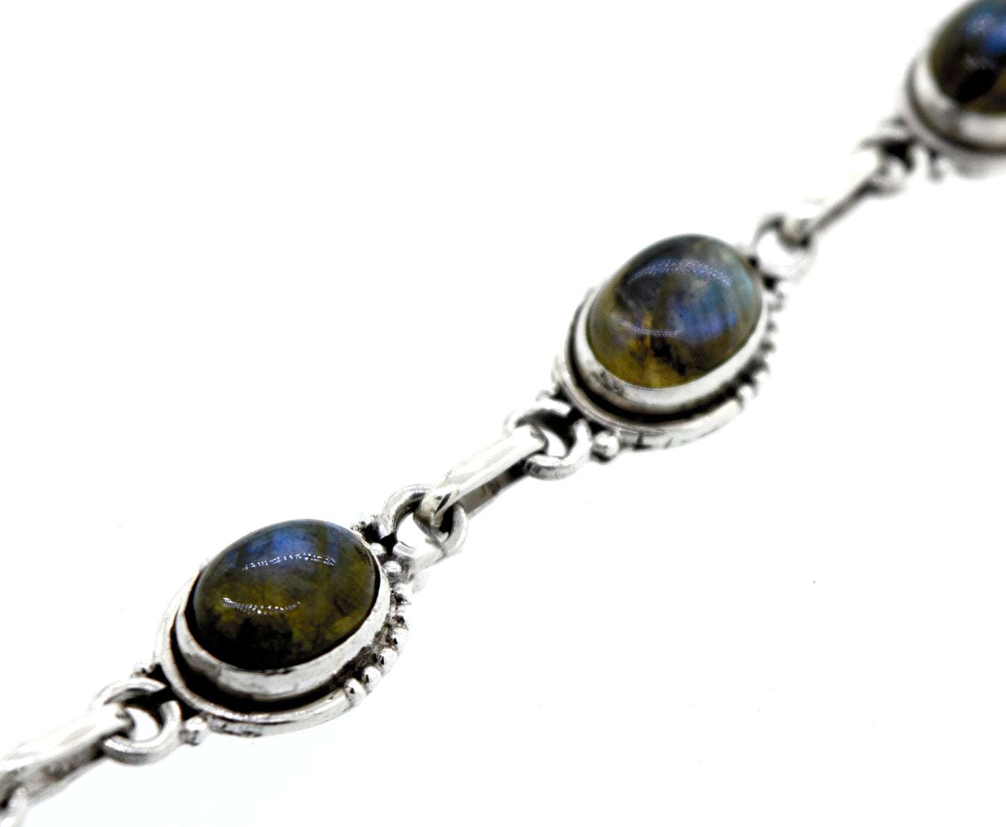 
                  
                    A Super Silver Oval Gemstone Bracelet with Half Ball Border adorned with labradorite stones.
                  
                