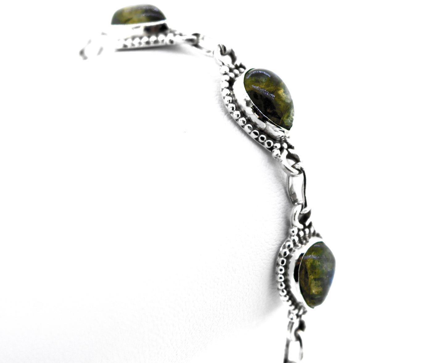 A vibrant Super Silver bracelet adorned with Teardrop Shape Labradorite stones.