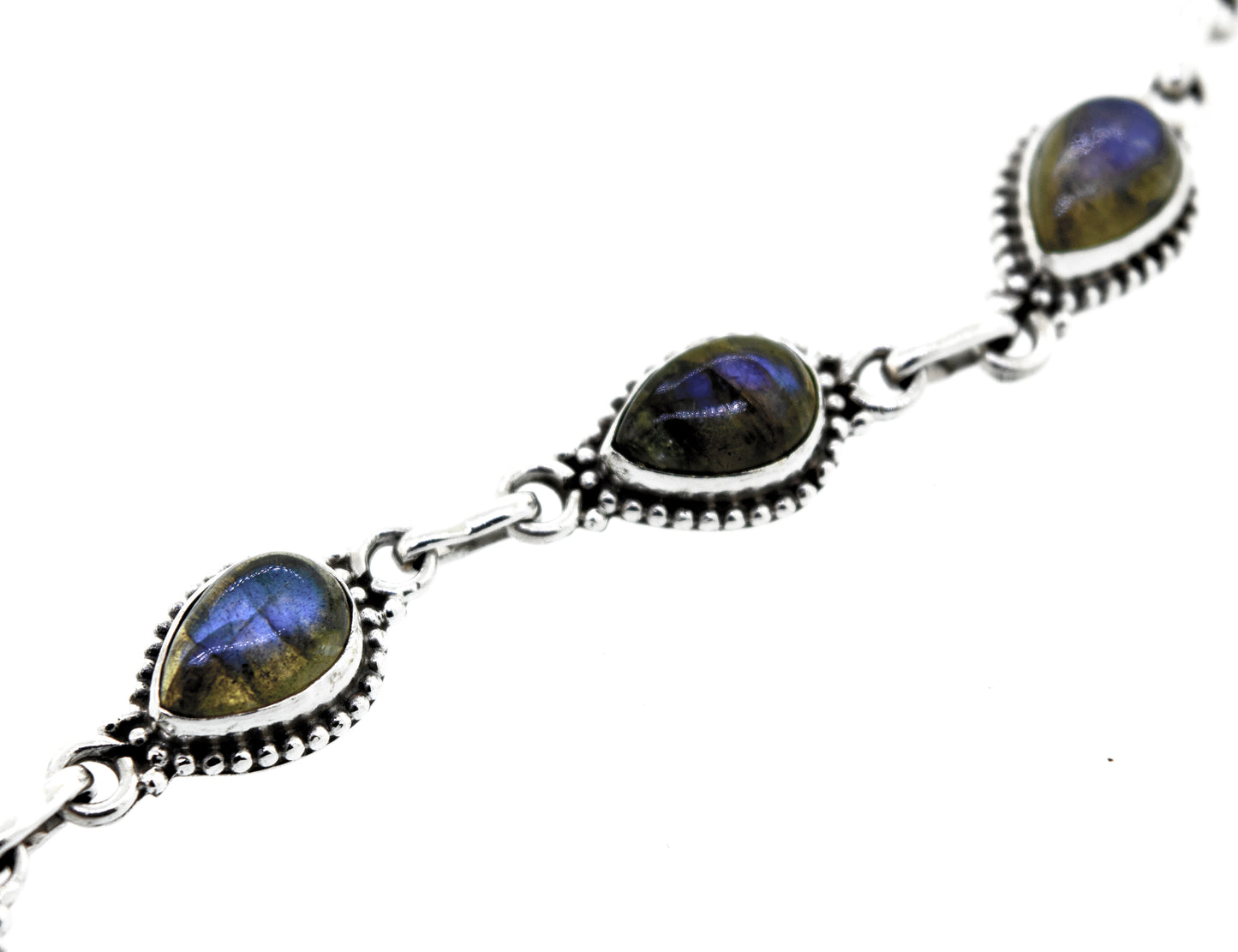 
                  
                    A Teardrop Shape Stone Bracelet With Ball Border crafted from .925 silver, featuring five teardrop-shaped gemstones with a captivating blue iridescent sheen.
                  
                