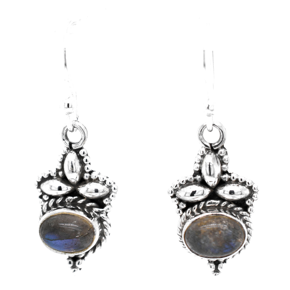 
                  
                    A pair of Captivating Petite Stone Earrings by Super Silver with labradorite gemstone stones.
                  
                