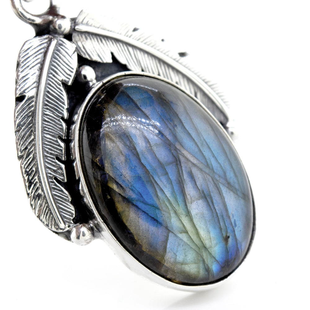 
                  
                    A Beautiful Labradorite pendant adorned with a delicate feather by Super Silver.
                  
                