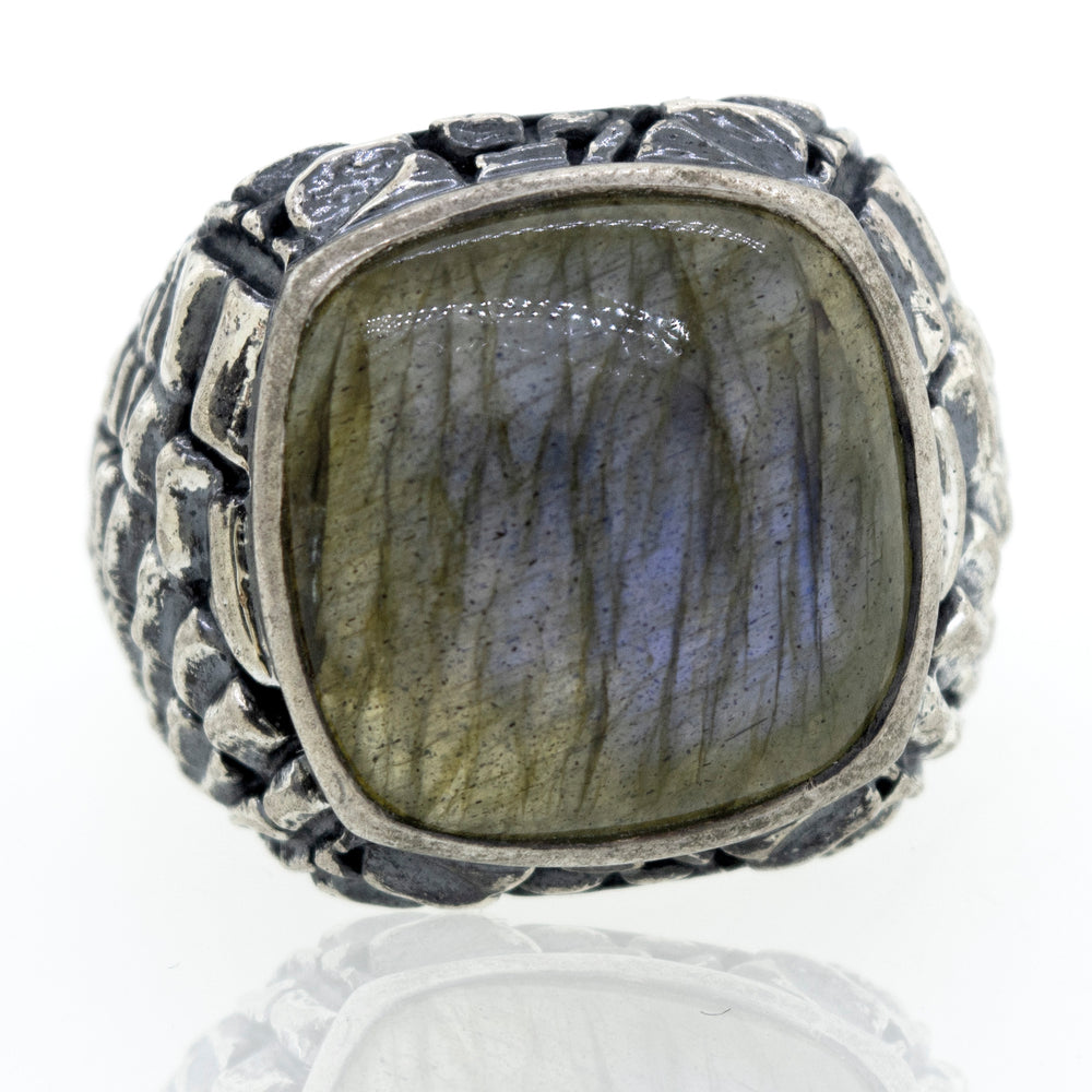 A minimalist sterling silver ring with a Heavy Signet Labradorite stone.