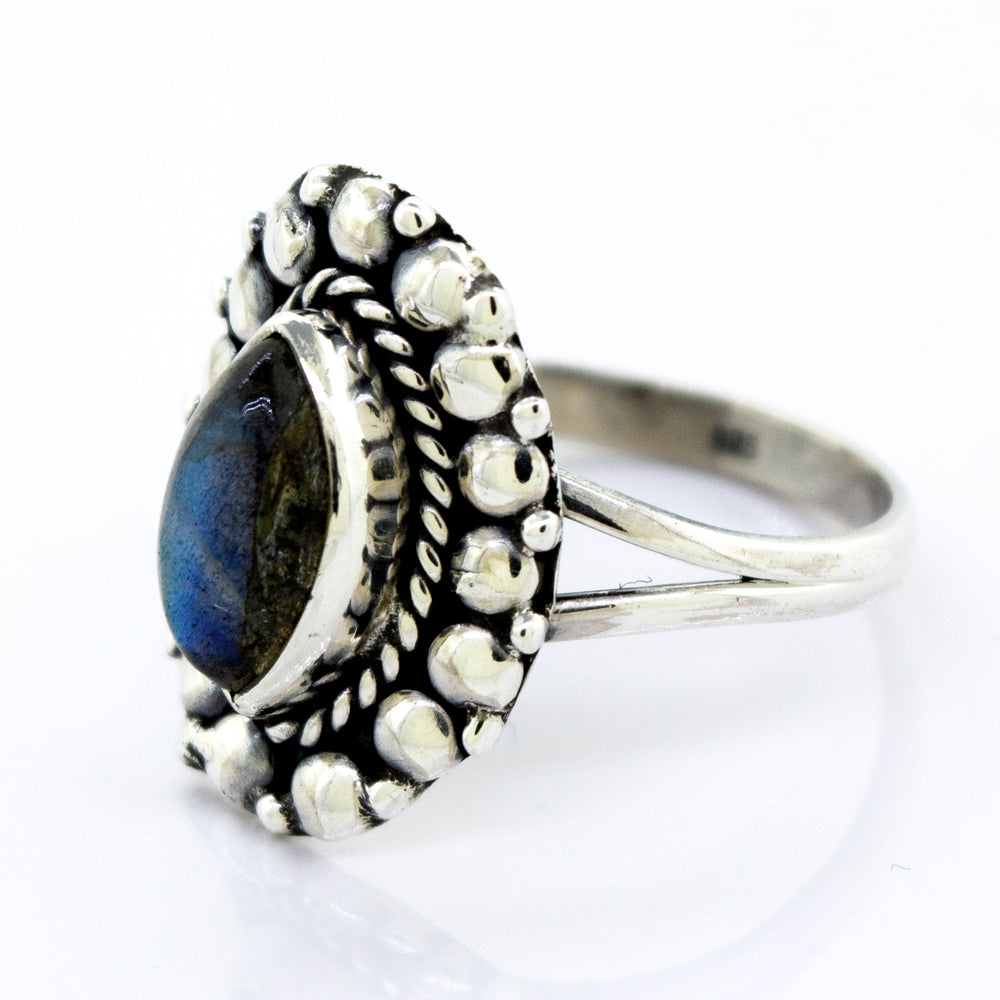 A Marquise Shaped Vibrant Labradorite Stone Ring from Super Silver featuring a beaded design.