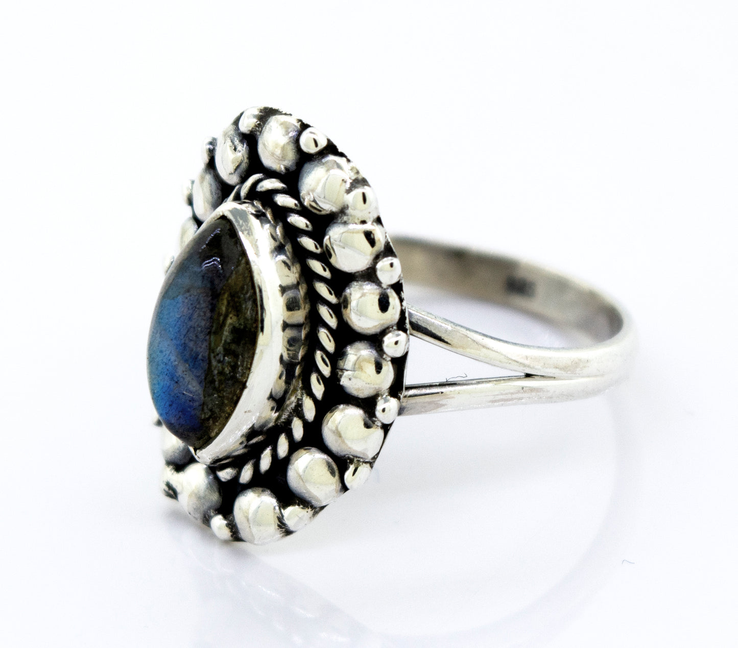 A Marquise Shaped Vibrant Labradorite Stone Ring from Super Silver featuring a beaded design.