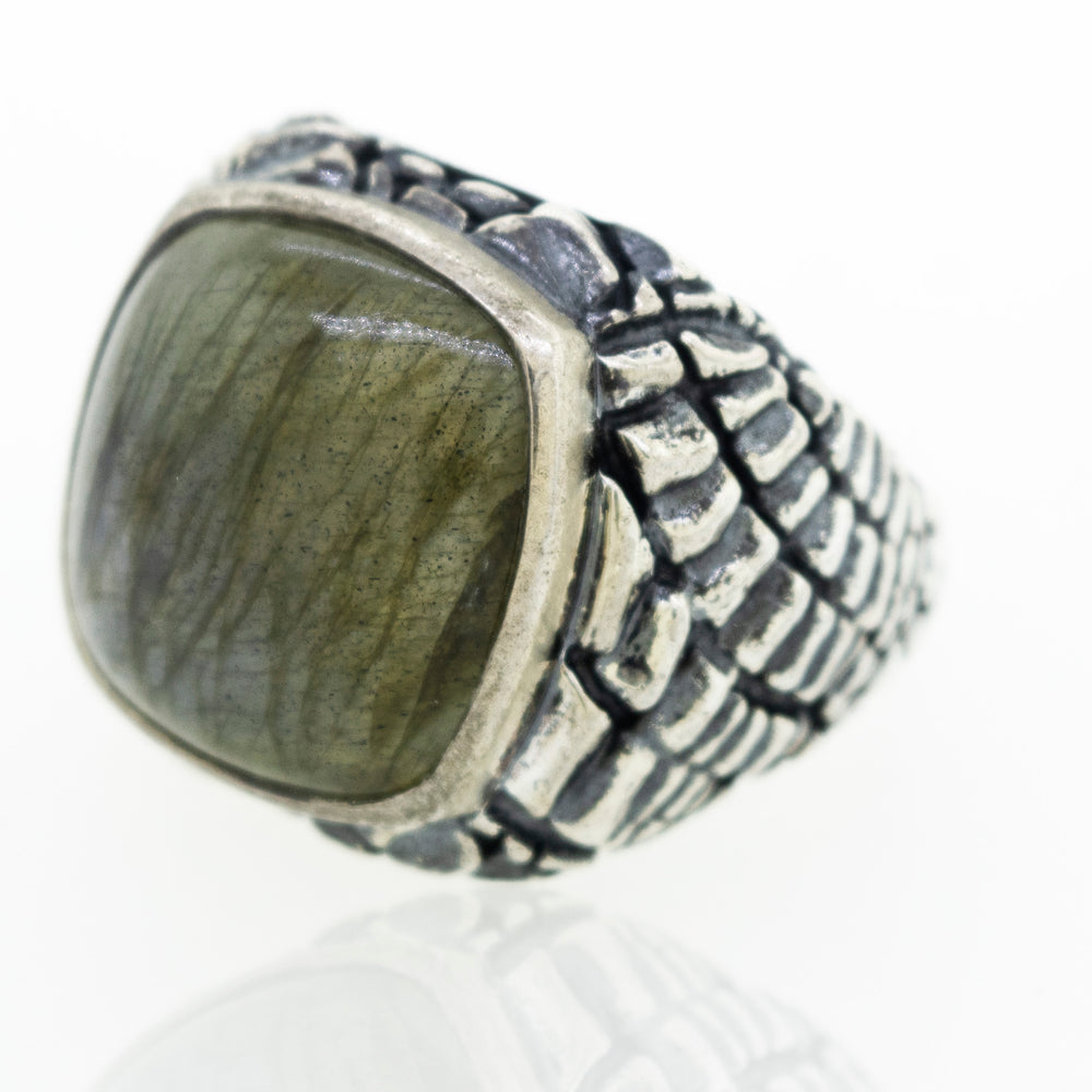 A minimalist silver Heavy Signet Labradorite Ring with a labradorite stone.