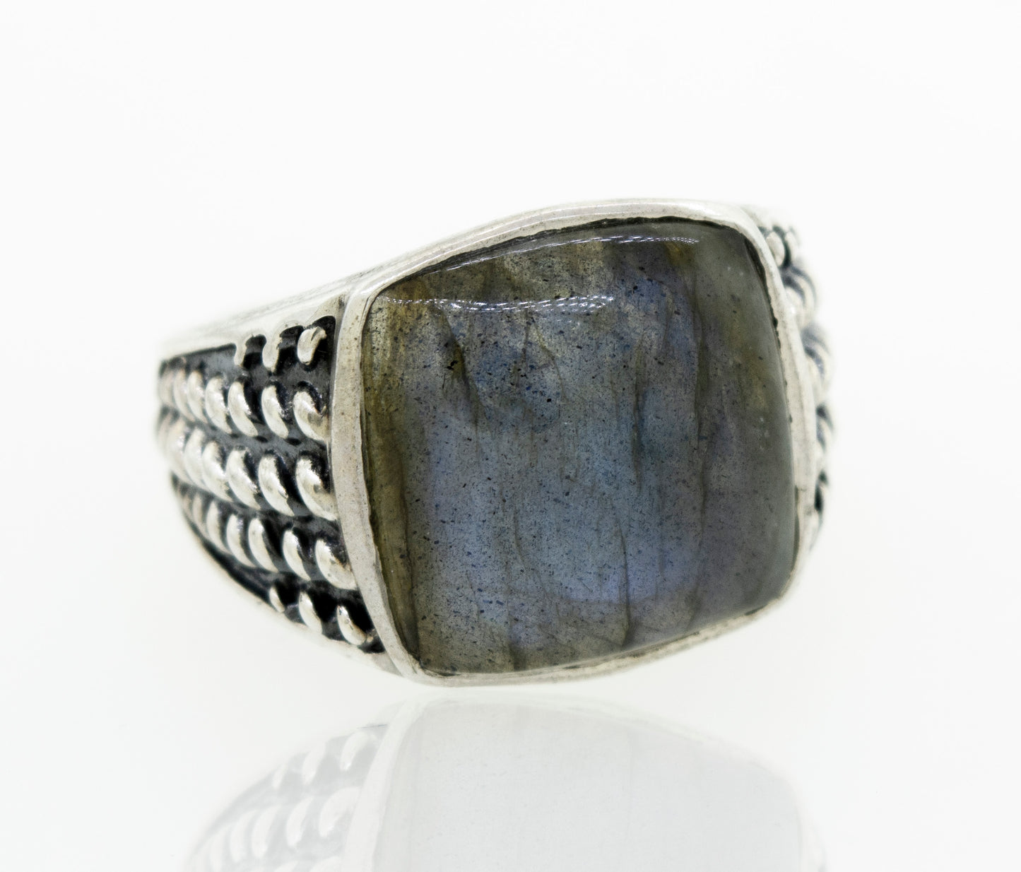 
                  
                    A minimalist sterling silver labradorite signet ring with a rope design.
                  
                