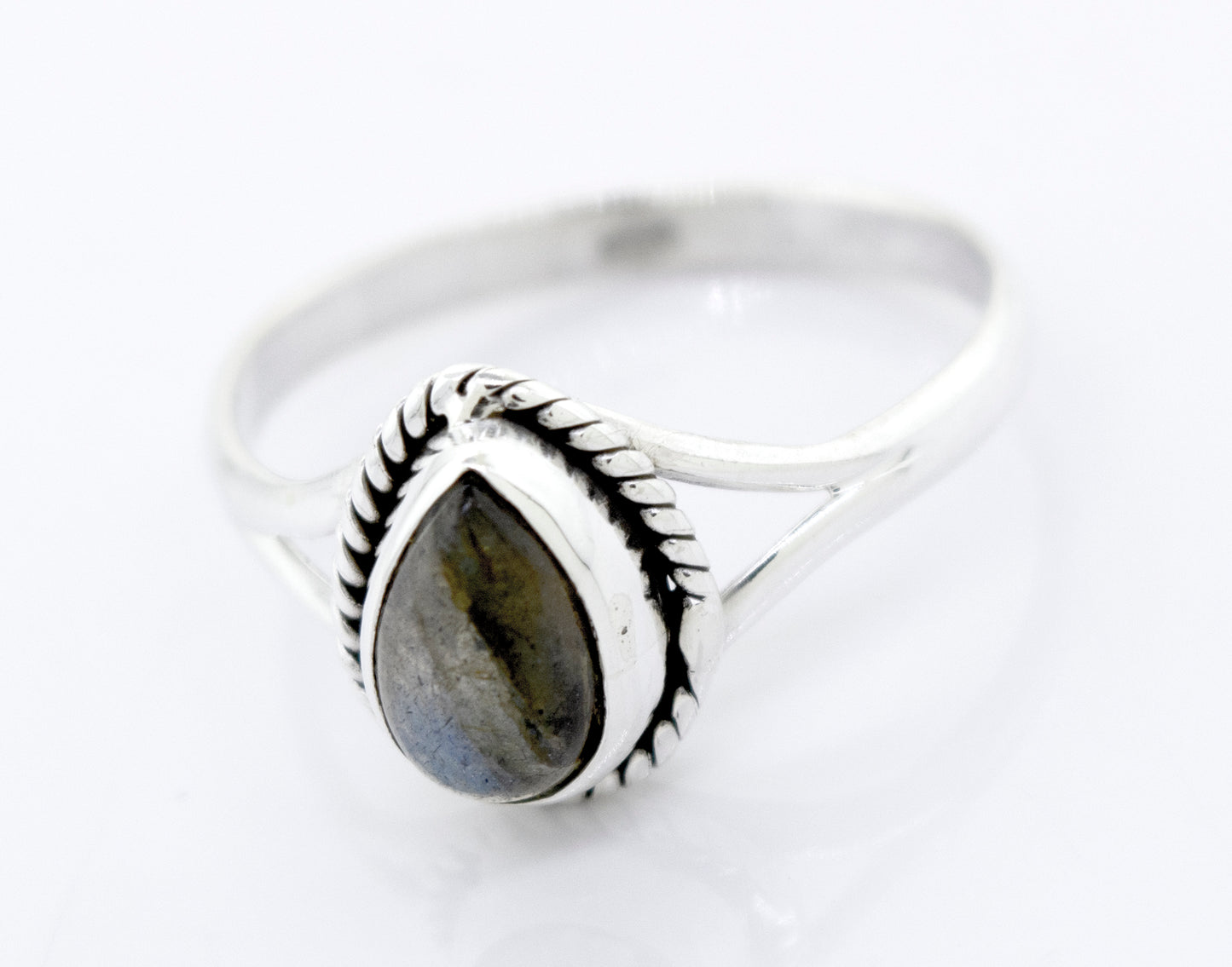 
                  
                    This Vibrant Teardrop Shape labradorite ring features a teardrop shape stone set in Super Silver.
                  
                