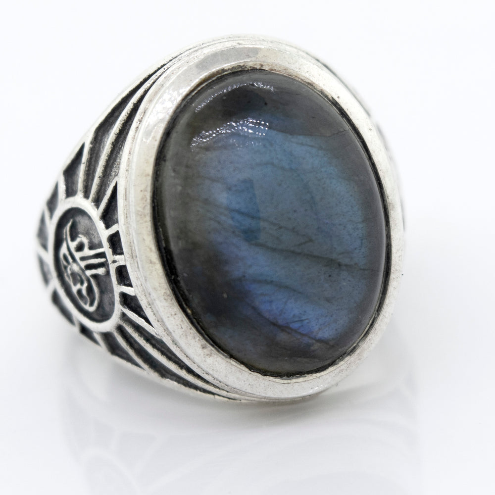 A statement sterling silver Labradorite Oval Signet Ring With Wolf Symbol.