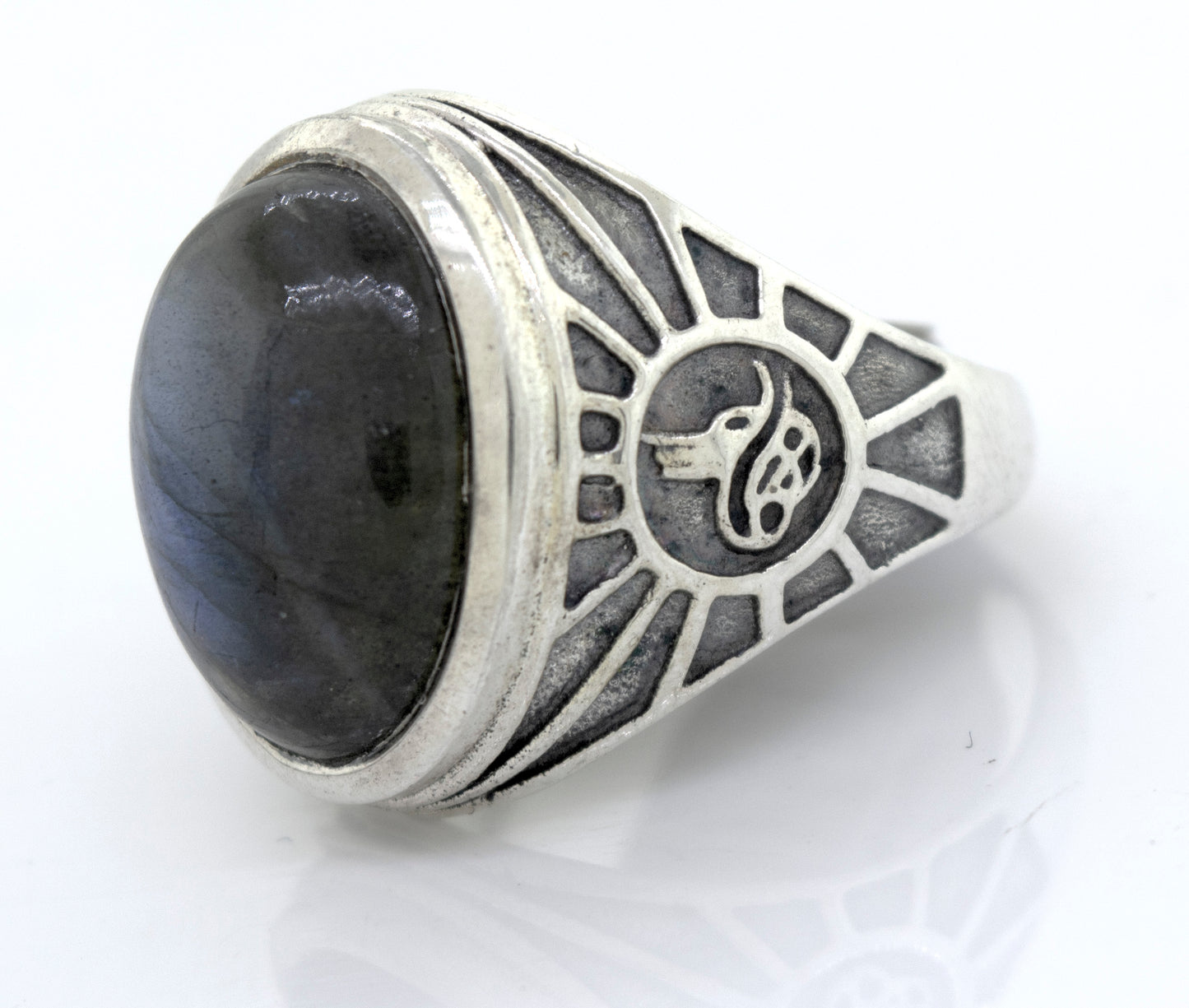 
                  
                    A mens sterling silver ring with a Labradorite Oval Signet Ring With Wolf Symbol.
                  
                