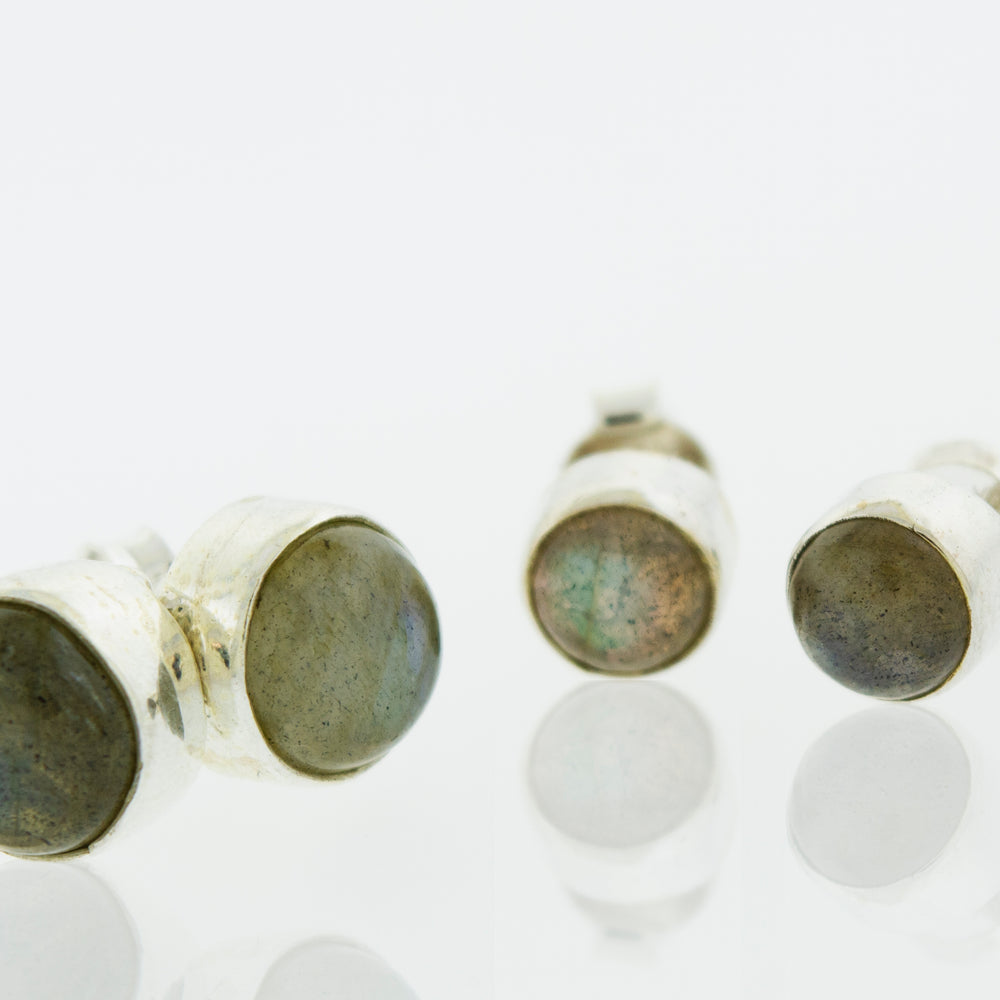 
                  
                    A pair of Simple Circle Labradorite Studs by Super Silver, perfect for every day wear, displayed on a white surface.
                  
                