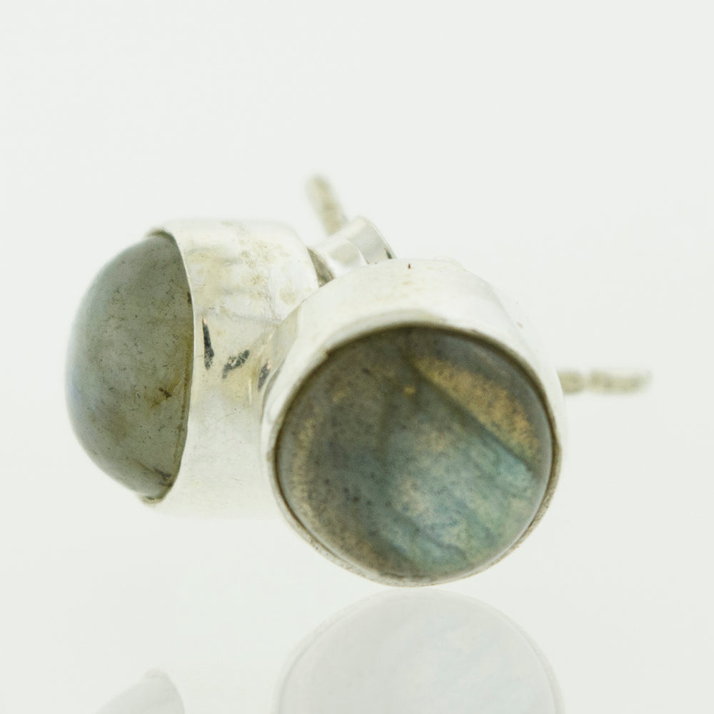 A pair of Simple Circle Labradorite stud earrings by Super Silver on a white surface, perfect for every day wear.