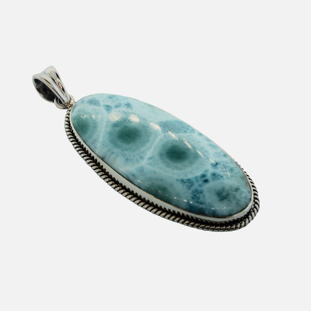 
                  
                    A statement Large Oblong Larimar Pendant with Rope Border made of Sterling Silver by Super Silver.
                  
                