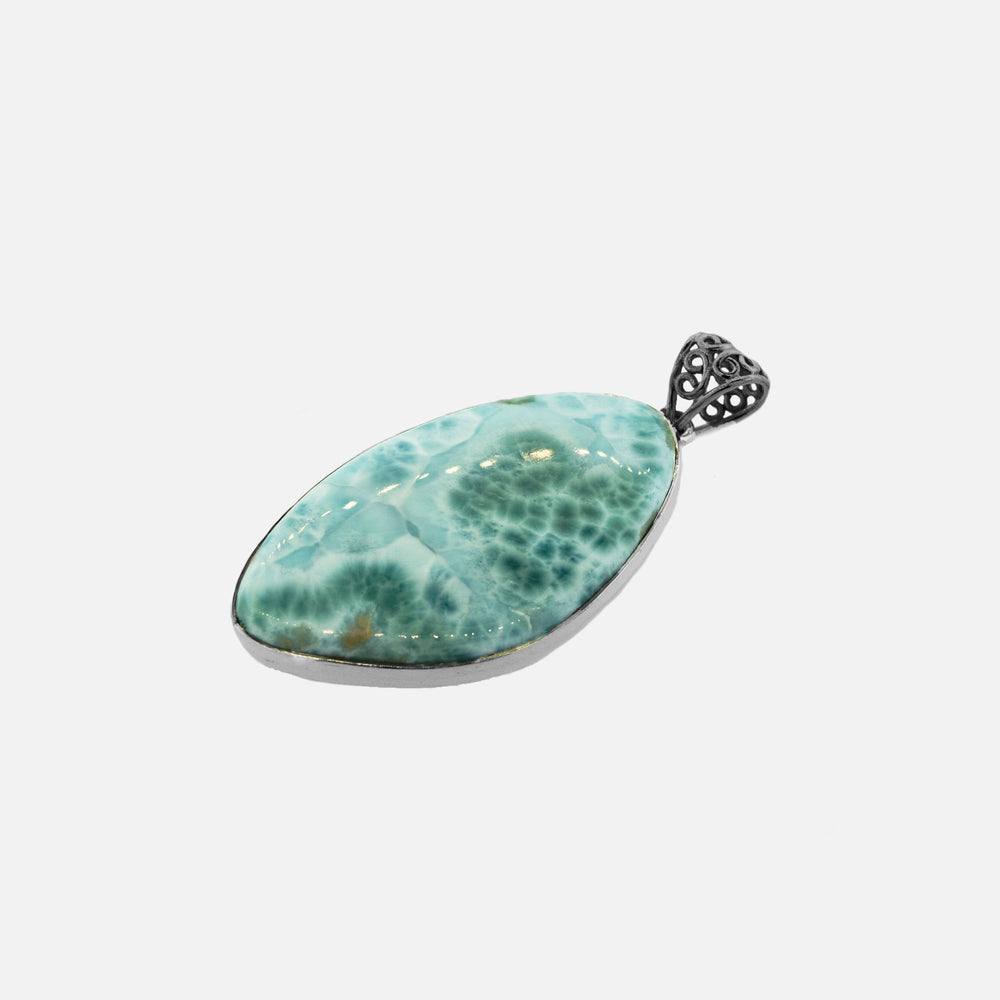 
                  
                    An oval Larger Larimar Pendant on a white background, perfect to make your outfit stand out with its Super Silver accent.
                  
                