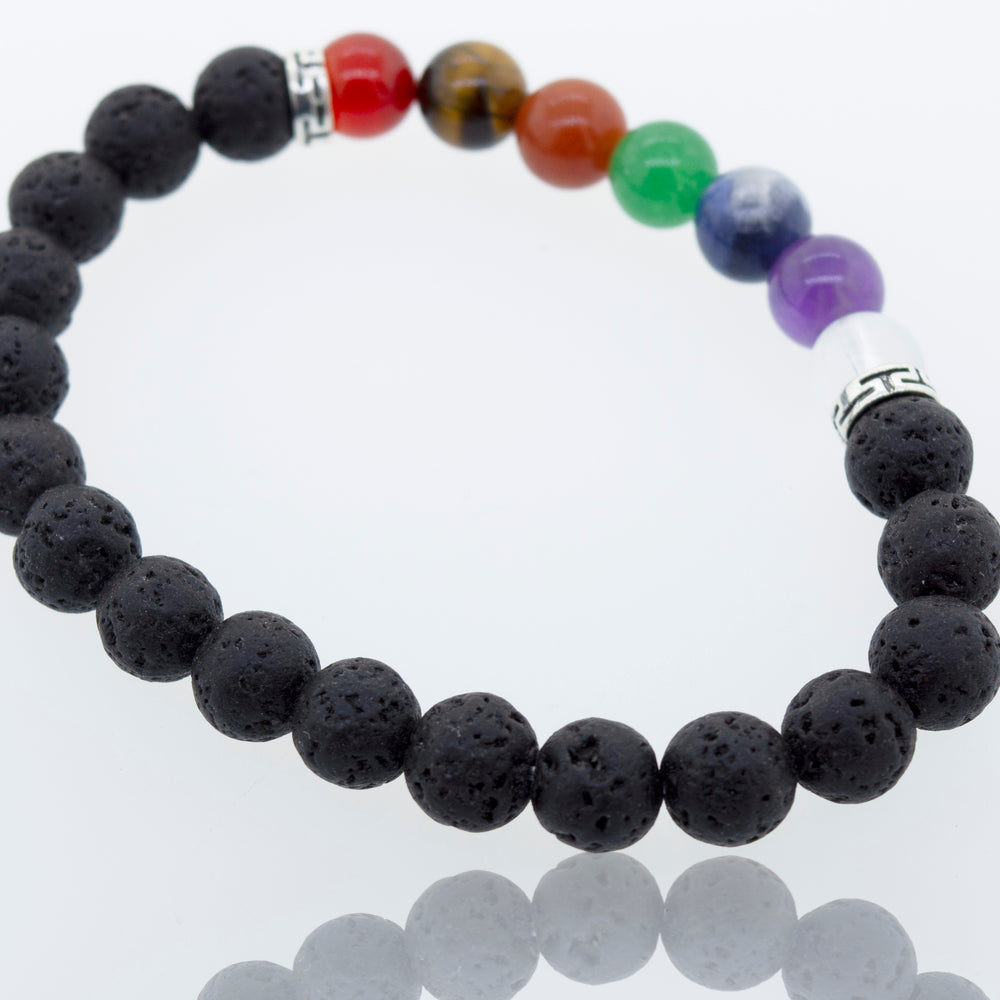 This Essential Oil Bracelet with Lava and Chakra Stones from Super Silver features colorful stones, providing balance and chakra energy.