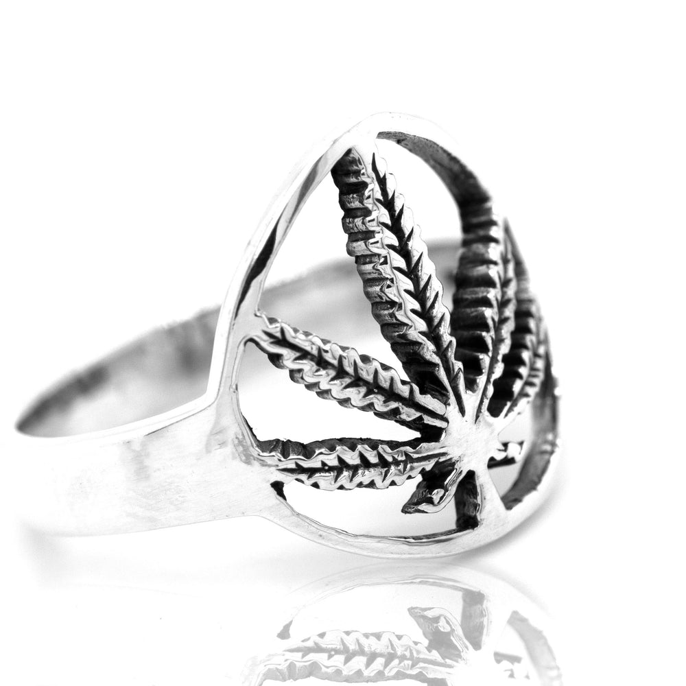 
                  
                    Channeling stoner vibes from the flower power era, this Outlined Mary Jane Leaf Ring features a sleek silver band with an eye-catching marijuana leaf design.
                  
                