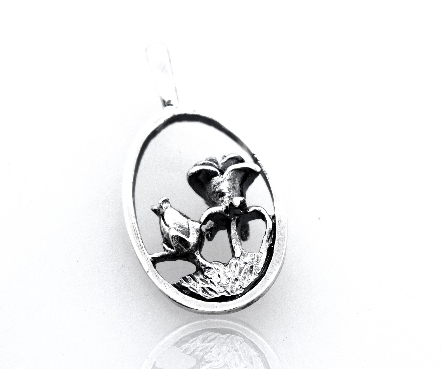A Super Silver sterling silver pendant with a lotus flower on an oval shape.