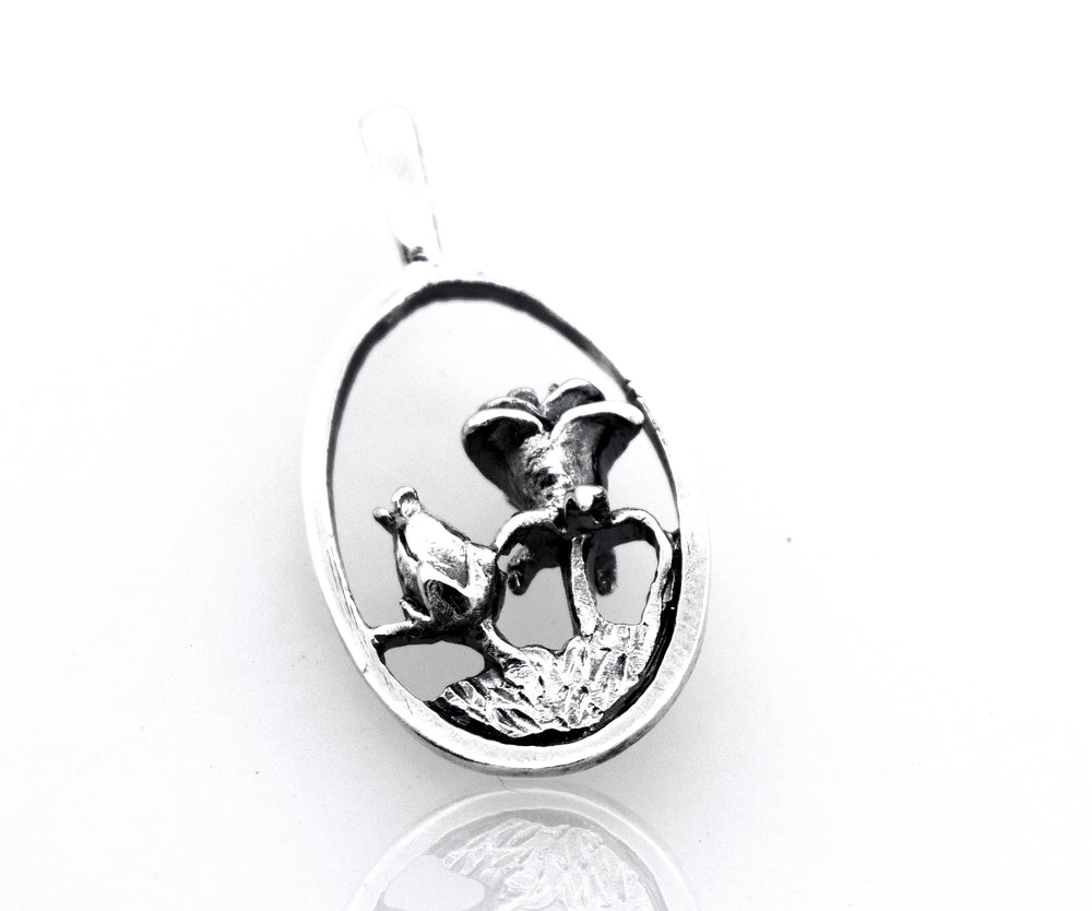 A Super Silver sterling silver pendant with a lotus flower on an oval shape.