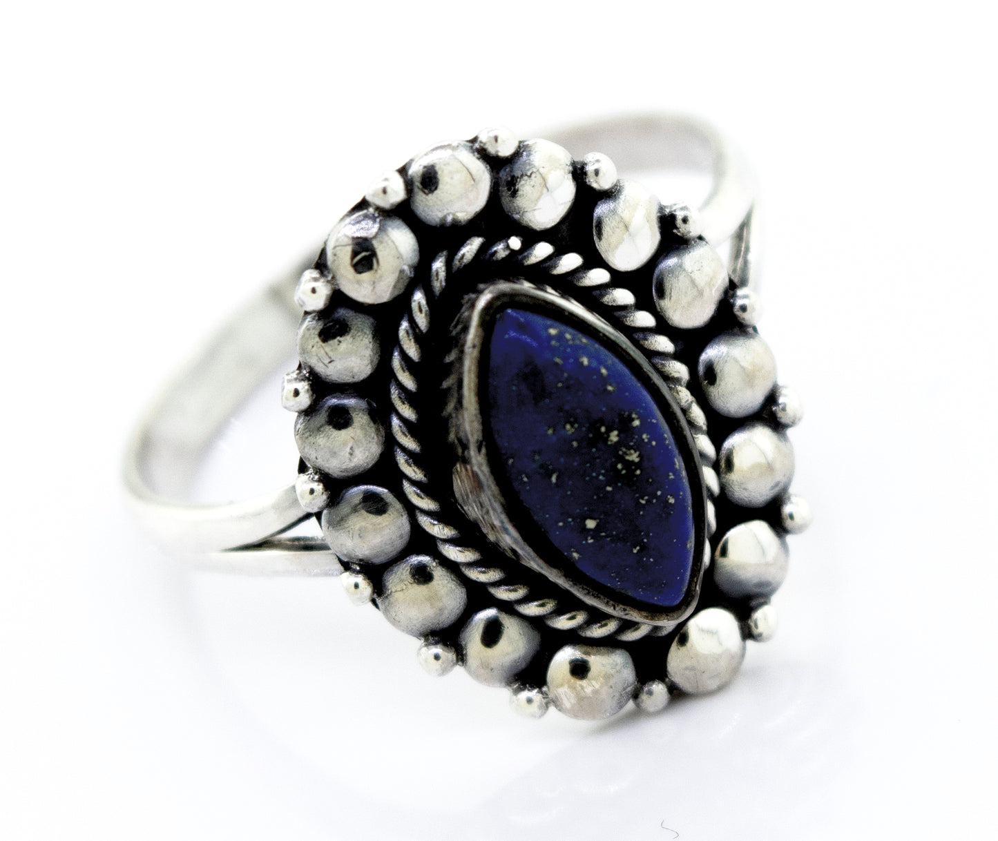 
                  
                    A stunning Super Silver Marquise Shaped Vibrant Lapis Ring with a lapis stone in the center, showcasing a beaded design on the setting.
                  
                