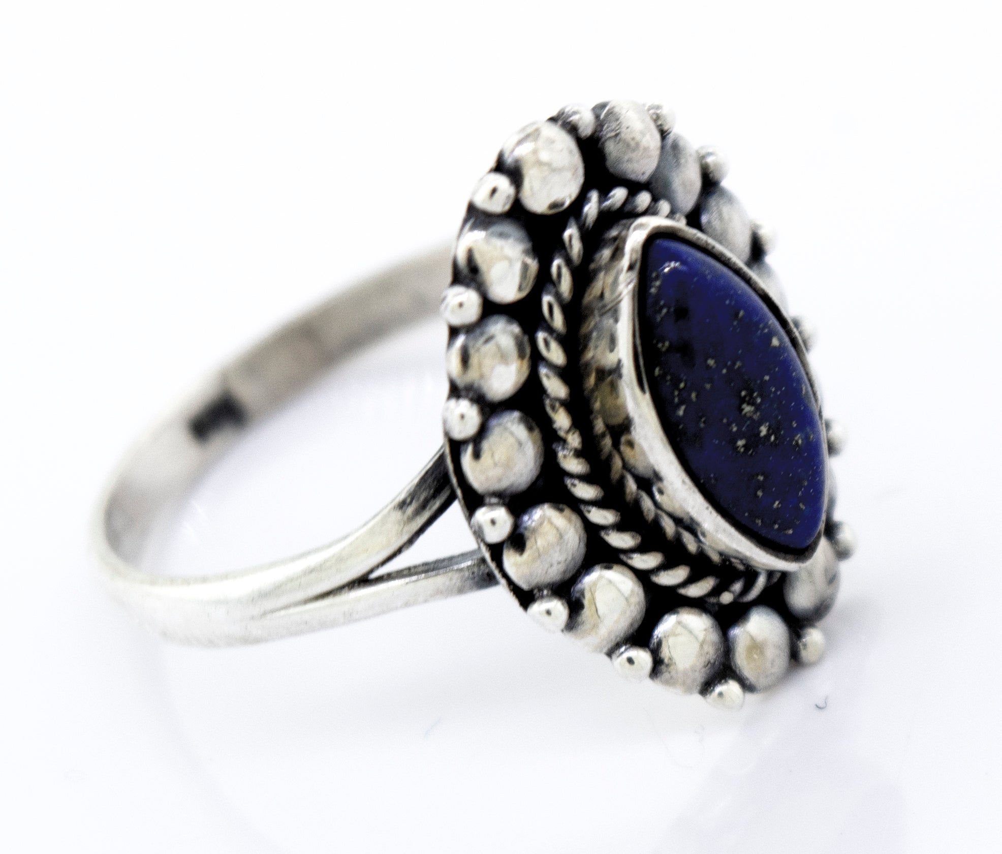 A Marquise Shaped Vibrant Lapis Ring by Super Silver in a beaded design setting.