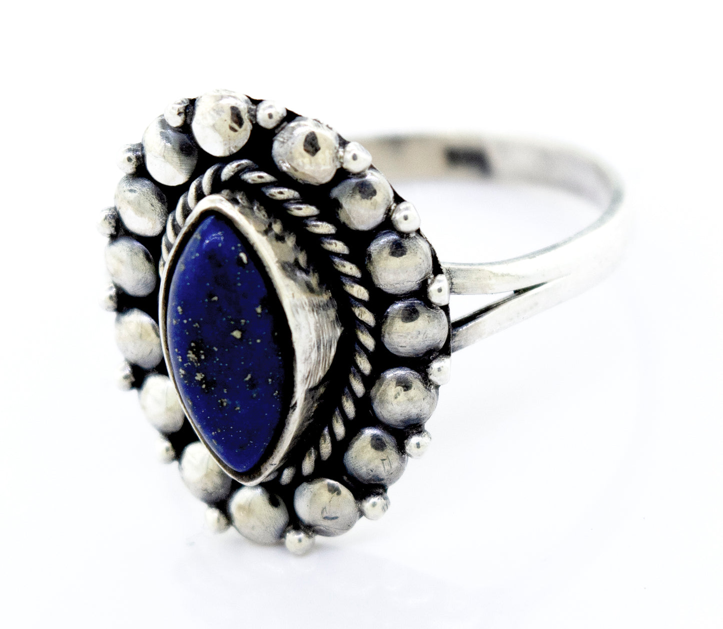A Marquise Shaped Vibrant Lapis Ring by Super Silver, with the lapis stone in the center, featuring a beaded design in the silver setting.