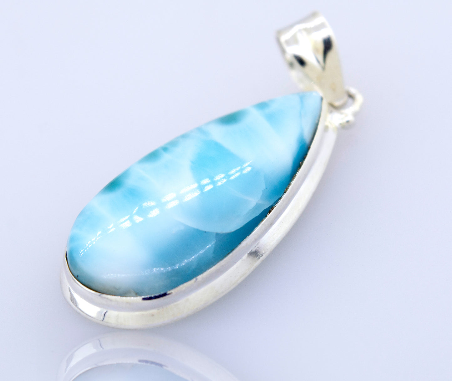 This Medium Teardrop Larimar pendant from Super Silver with a blue lazuli stone is perfect for any occasion and is sure to make you stand out.
