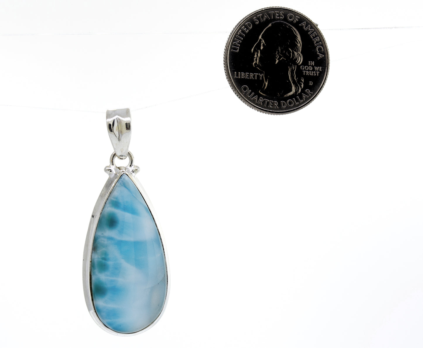 
                  
                    This eye-catching Super Silver pendant features a stunning Medium Teardrop Larimar stone, perfect for adding a touch of elegance to any occasion.
                  
                