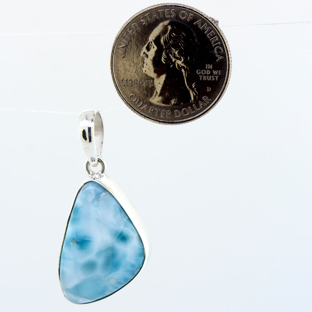 
                  
                    A Medium Larimar Pendant impressively designed with a vibrant blue larimar stone by Super Silver.
                  
                