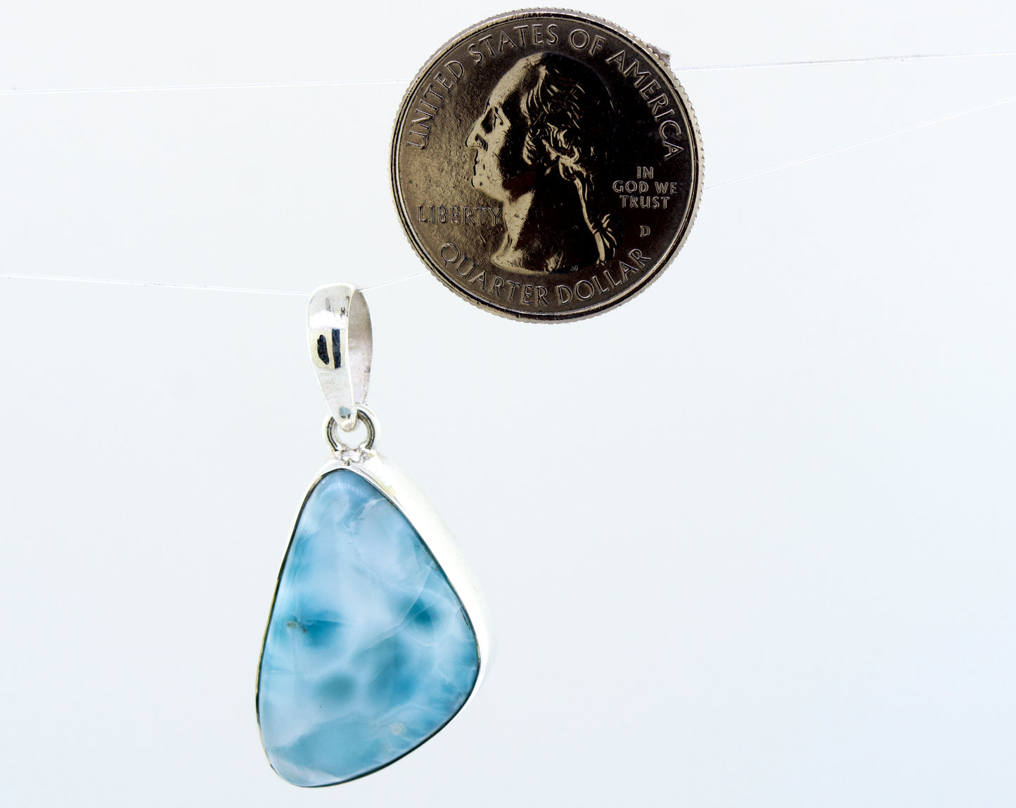 
                  
                    A Medium Larimar Pendant impressively designed with a vibrant blue larimar stone by Super Silver.
                  
                