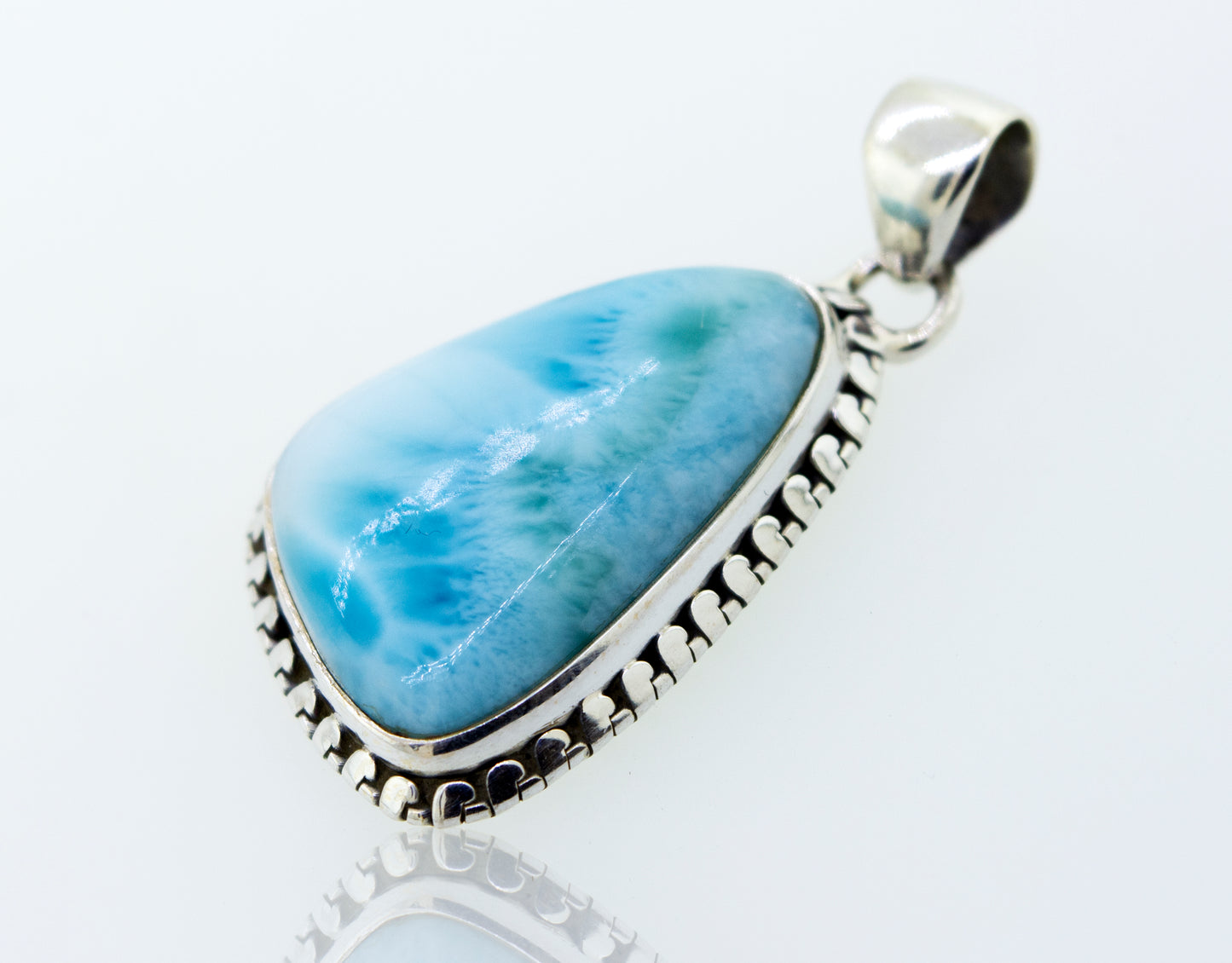 A stunning Medium Larimar Pendant with Ball Border by Super Silver, measuring 1.5 inches in length, showcasing a blue larimar stone set in .925 Sterling Silver.