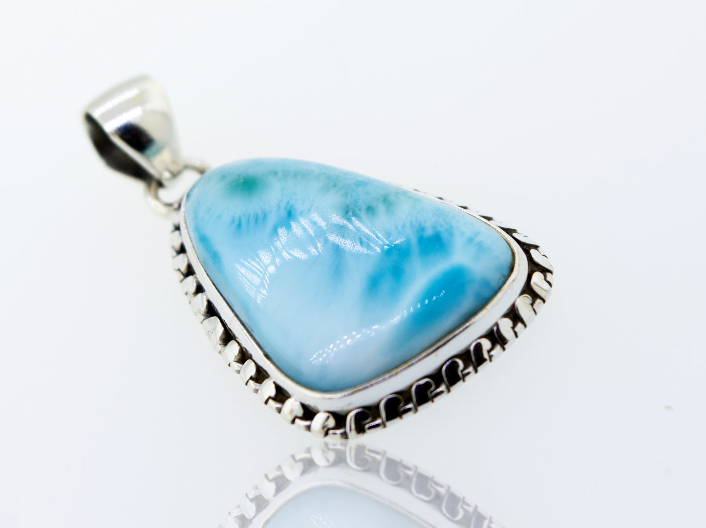 A stunning Super Silver Medium Larimar Pendant with Ball Border, measuring 1.5 inches in length.