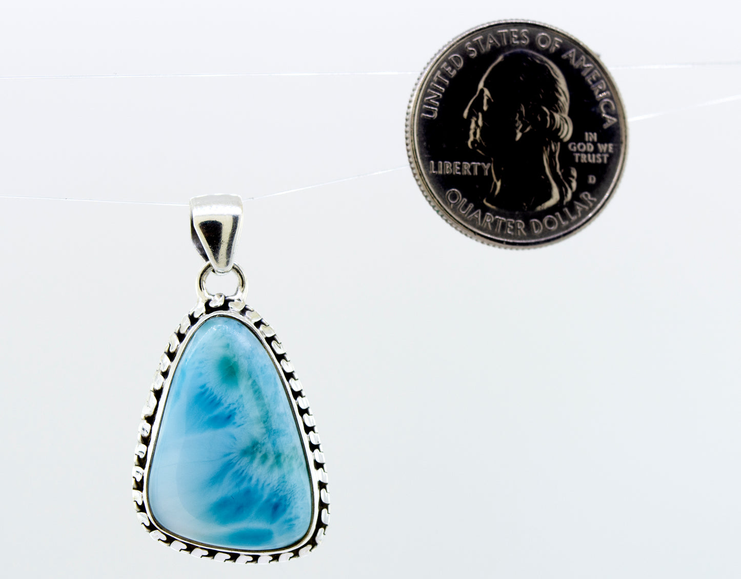 
                  
                    A stunning piece of jewelry, this Super Silver Medium Larimar Pendant with Ball Border features a beautiful blue agate stone. Measuring 1.5 inches in length, it adds a touch of elegance to any outfit.
                  
                