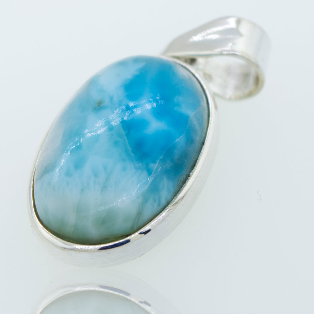 A gorgeous Super Silver sterling silver pendant with a smaller oval Larimar stone, perfect for everyday wear.