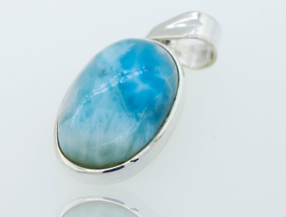
                  
                    A gorgeous Super Silver sterling silver pendant with a smaller oval Larimar stone, perfect for everyday wear.
                  
                