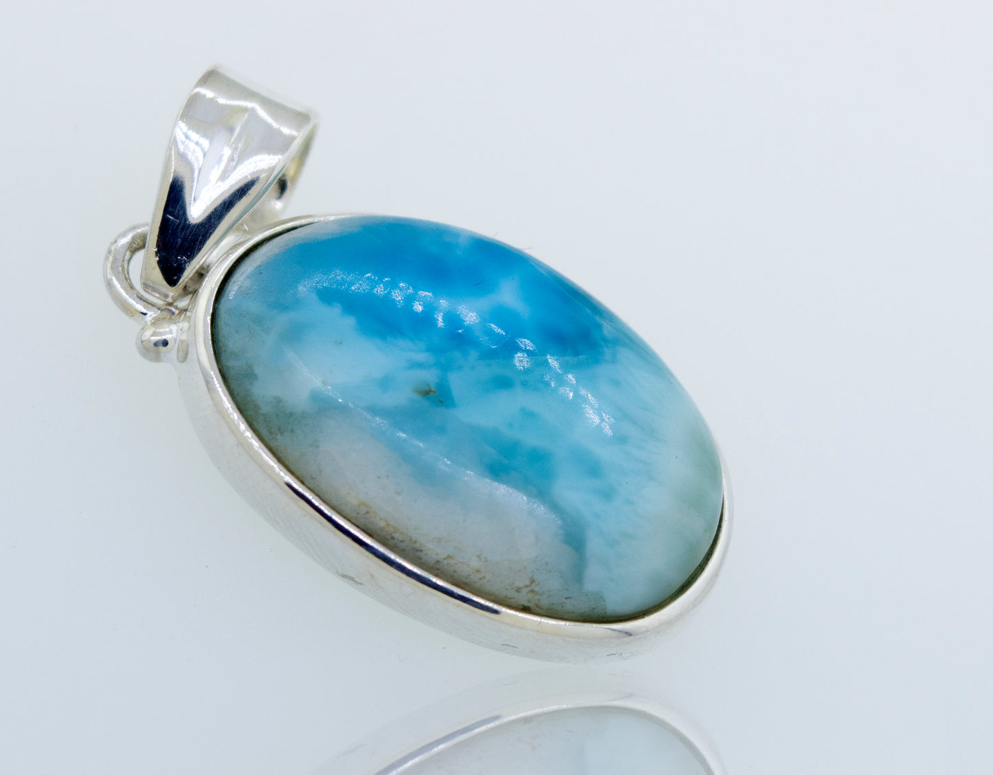 
                  
                    A gorgeous Super Silver Smaller Oval Larimar Pendant for everyday wear with a blue stone.
                  
                